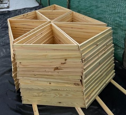 Wooden pieces for a 6-meter geodesic dome sorted by letter