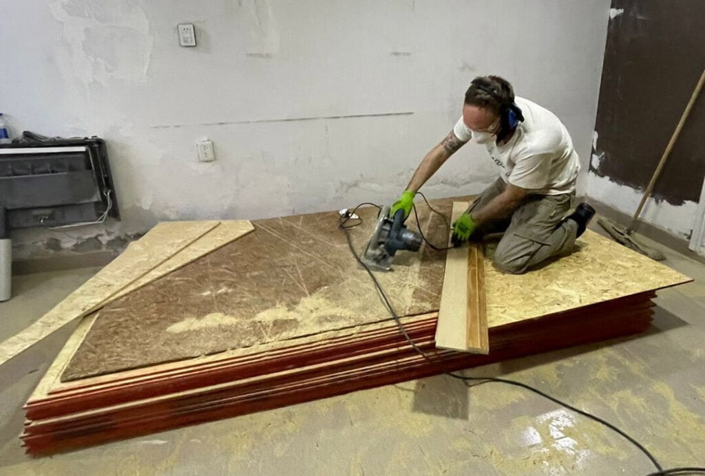 Cutting OSB triangles for a geodesic dome in workshop
